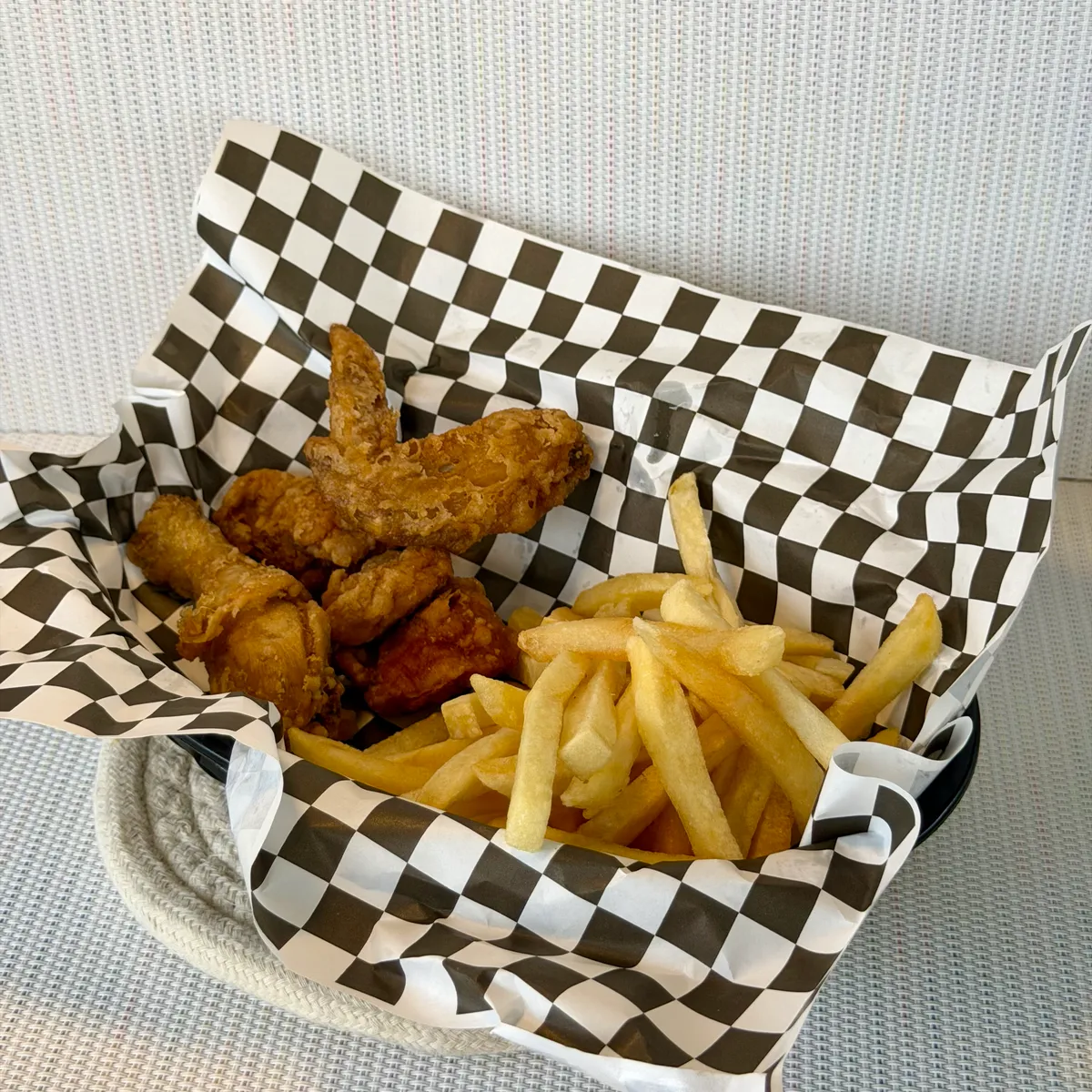 NamNam Combo Fries - fried chicken and fries in a checkered-lined basket